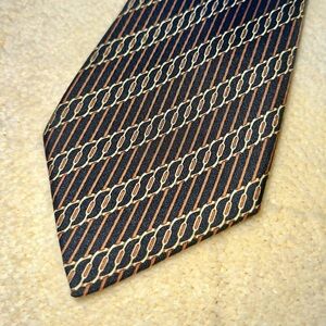 Hermes 100% silk necktie. Dark navy with brown stripes. 7040 TA. 3.5” wide